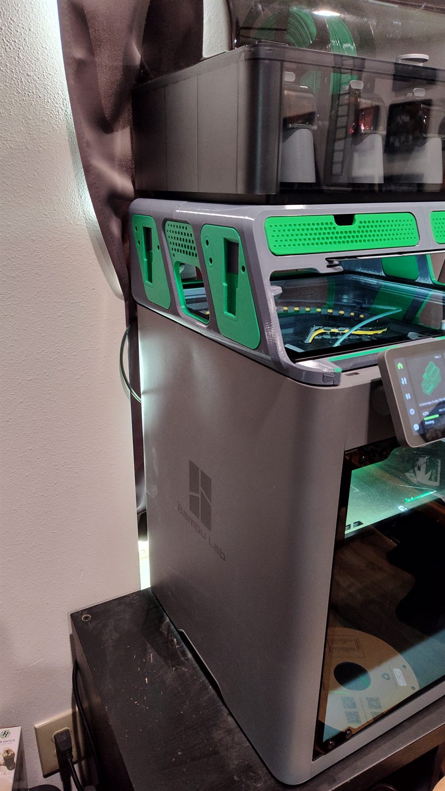 A 3D-printed AMS riser sitting between the Bambu P2S and the AMS unit