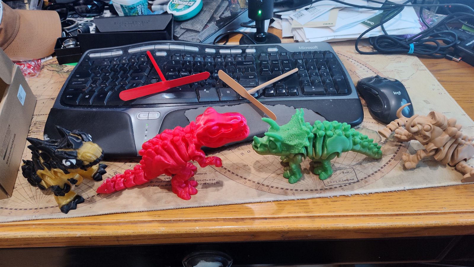 A collection of printed dinosaurs and dragons