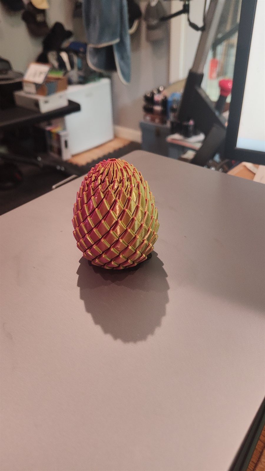 A close-up of a printed dragon egg