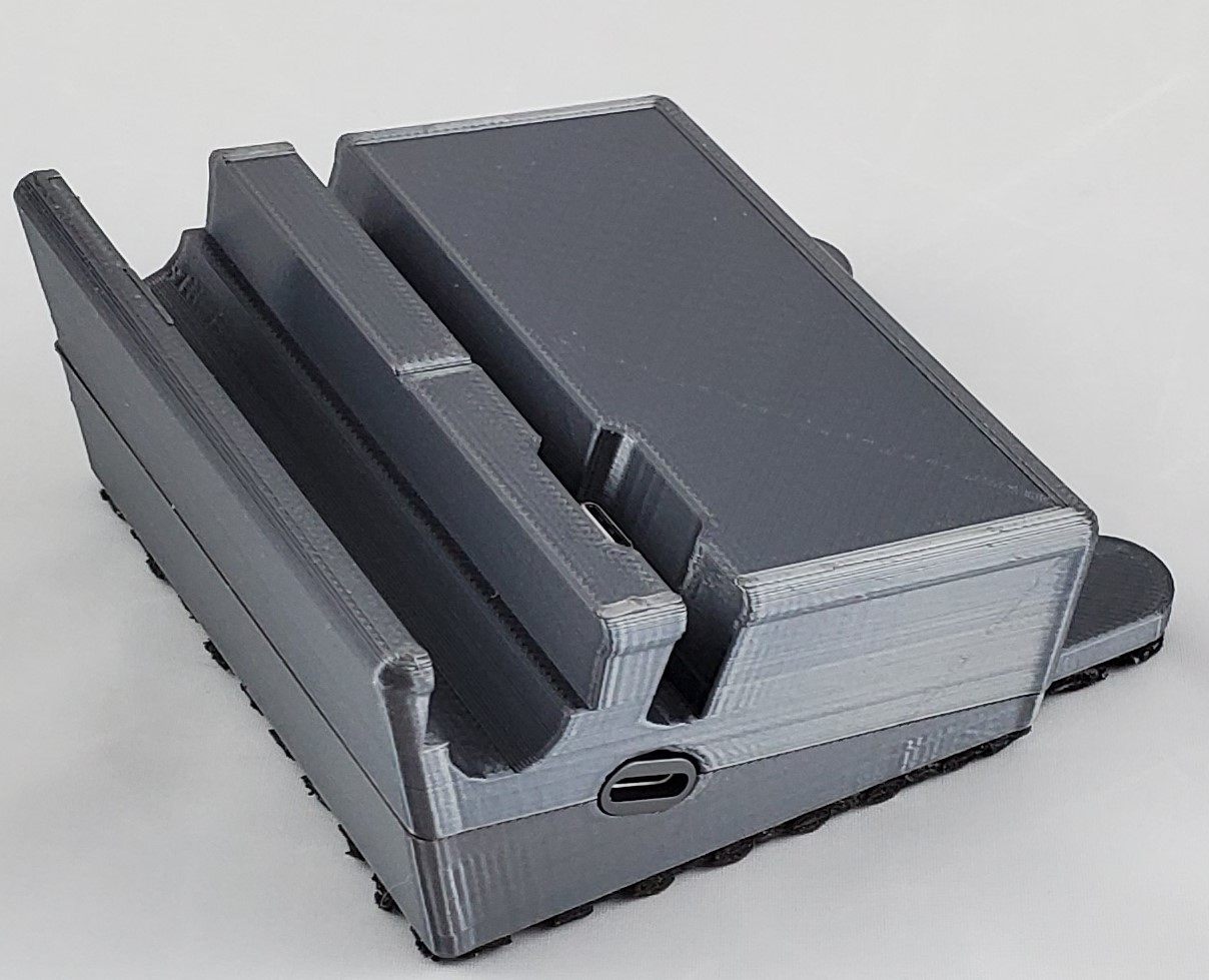 The Surface Duo dock printed in gray, showing the USB-C cutout