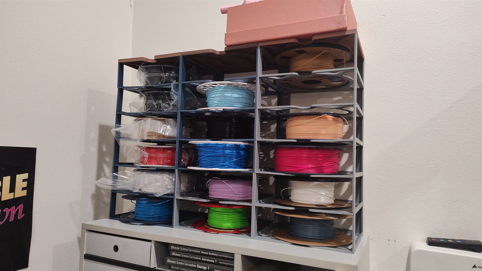 Printed filament racks holding many spools of filament