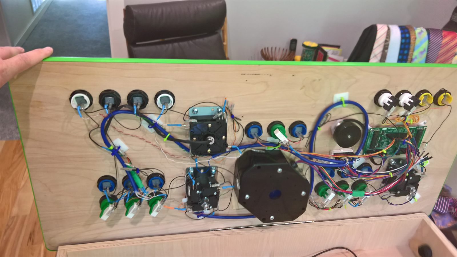 Wired panel laid flat on a table showing the I-PAC and harnesses