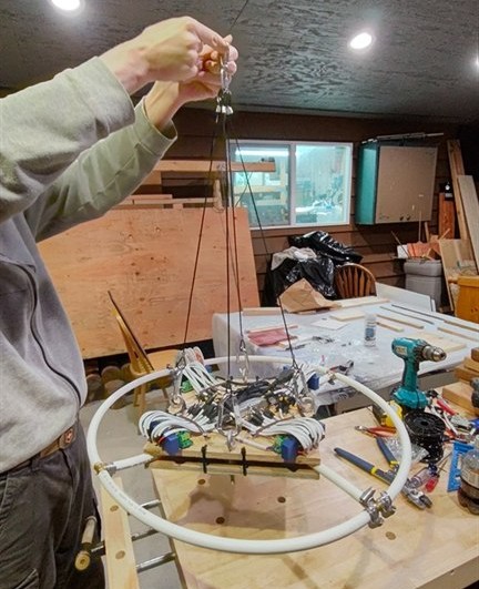 Suspension rig attached to the platform with eye bolts and wire