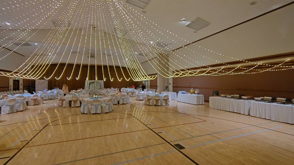 Another deployed view of the lighting system across the cultural hall
