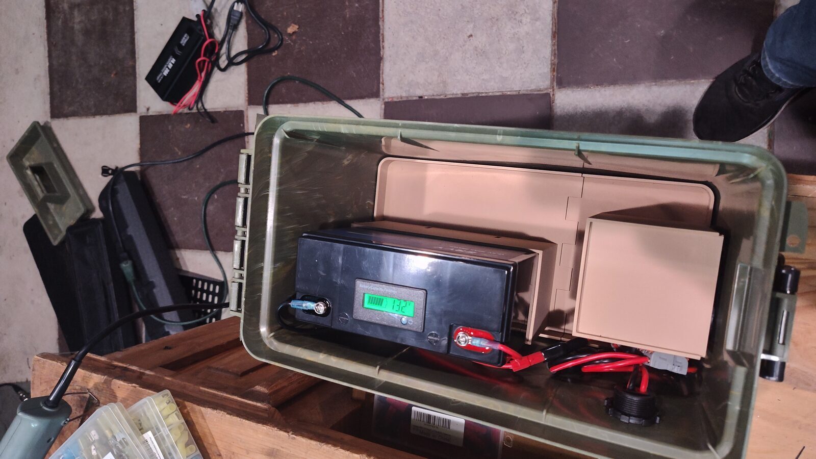 Battery box viewed from above with the battery and wiring visible
