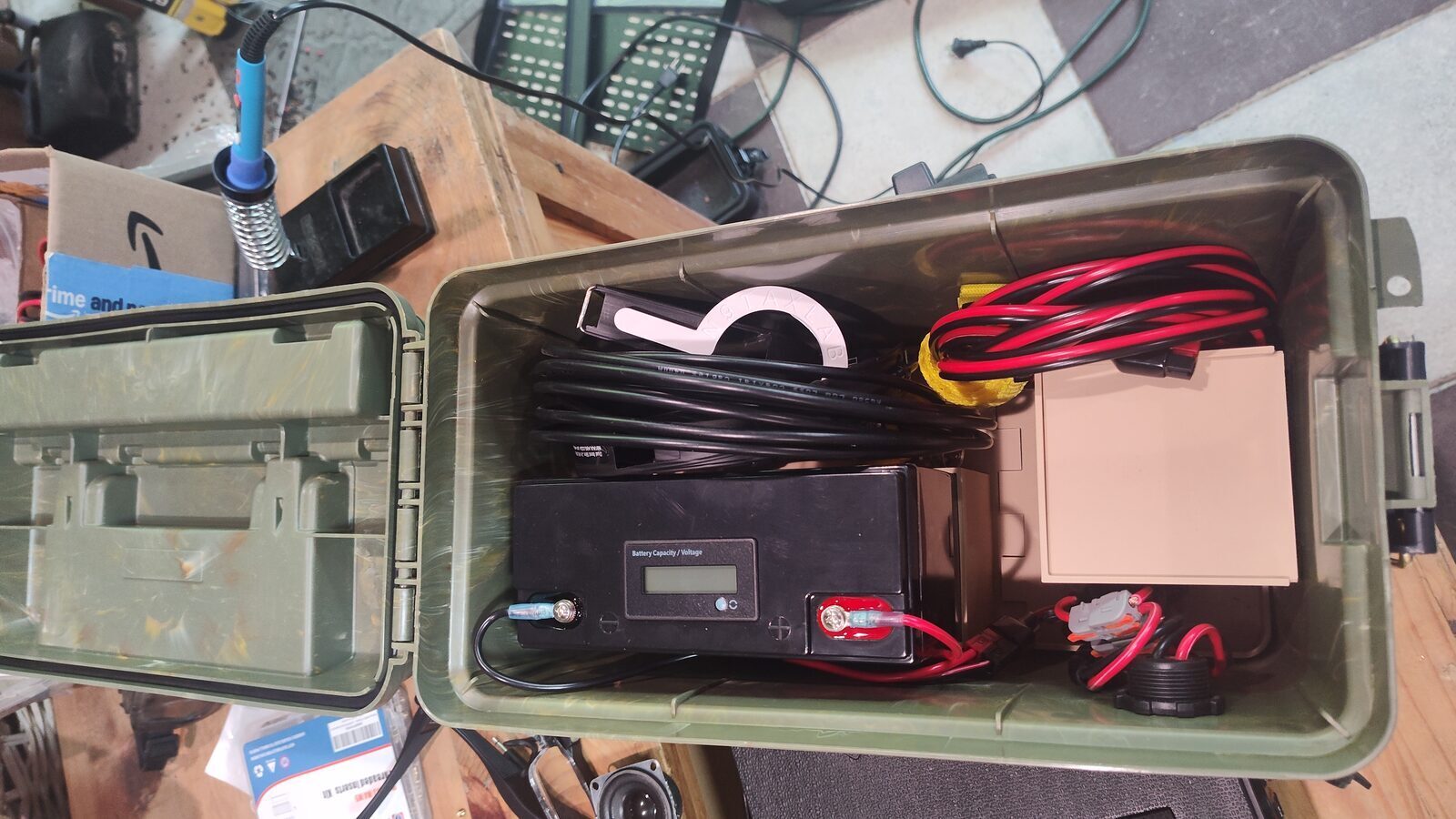 Loaded battery box with the battery, wiring, and storage area in place