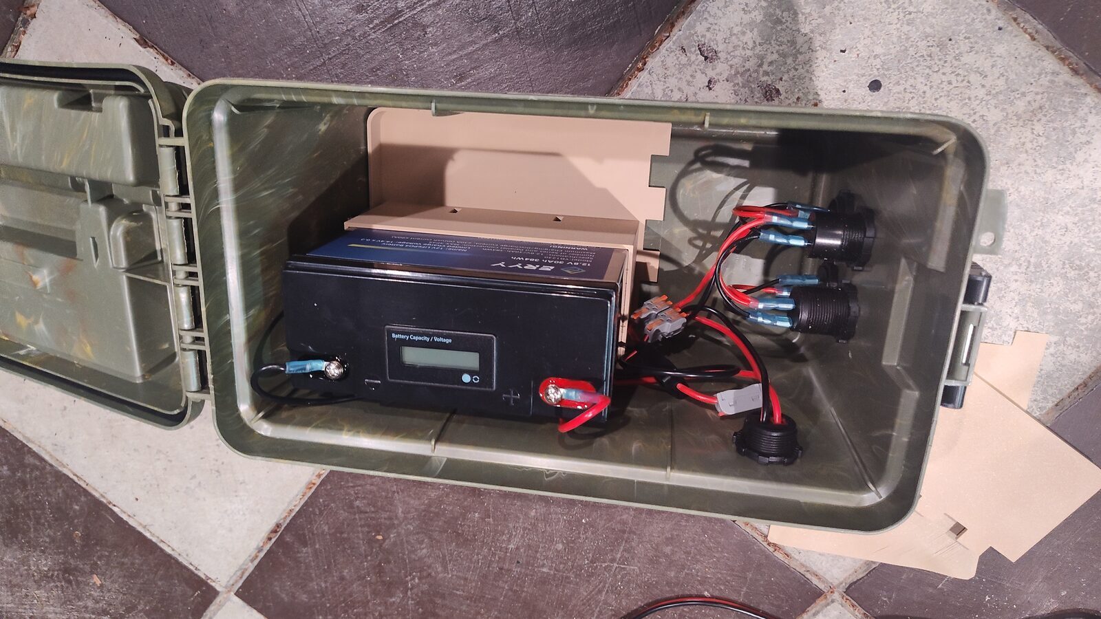Battery box tray holding the battery and power components
