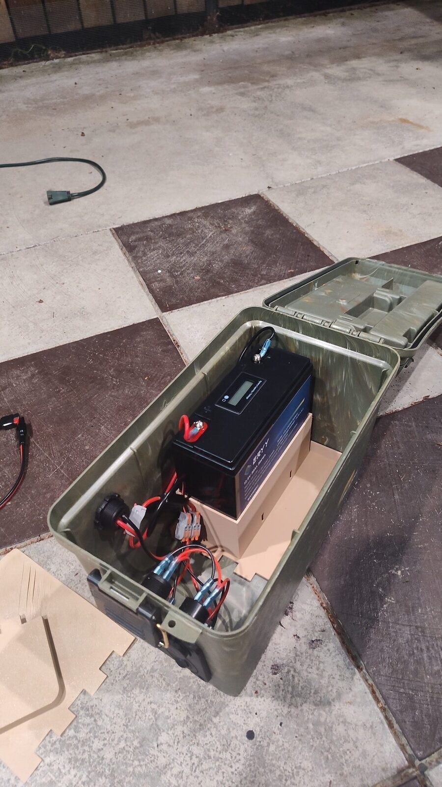 Battery box with wiring exposed for inspection