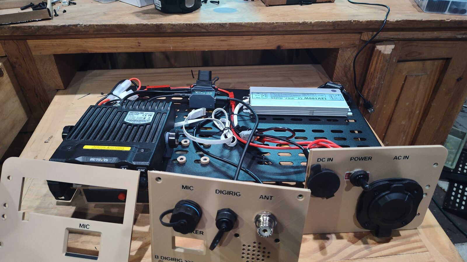 Radio hardcase during final assembly with the shelf and wiring visible