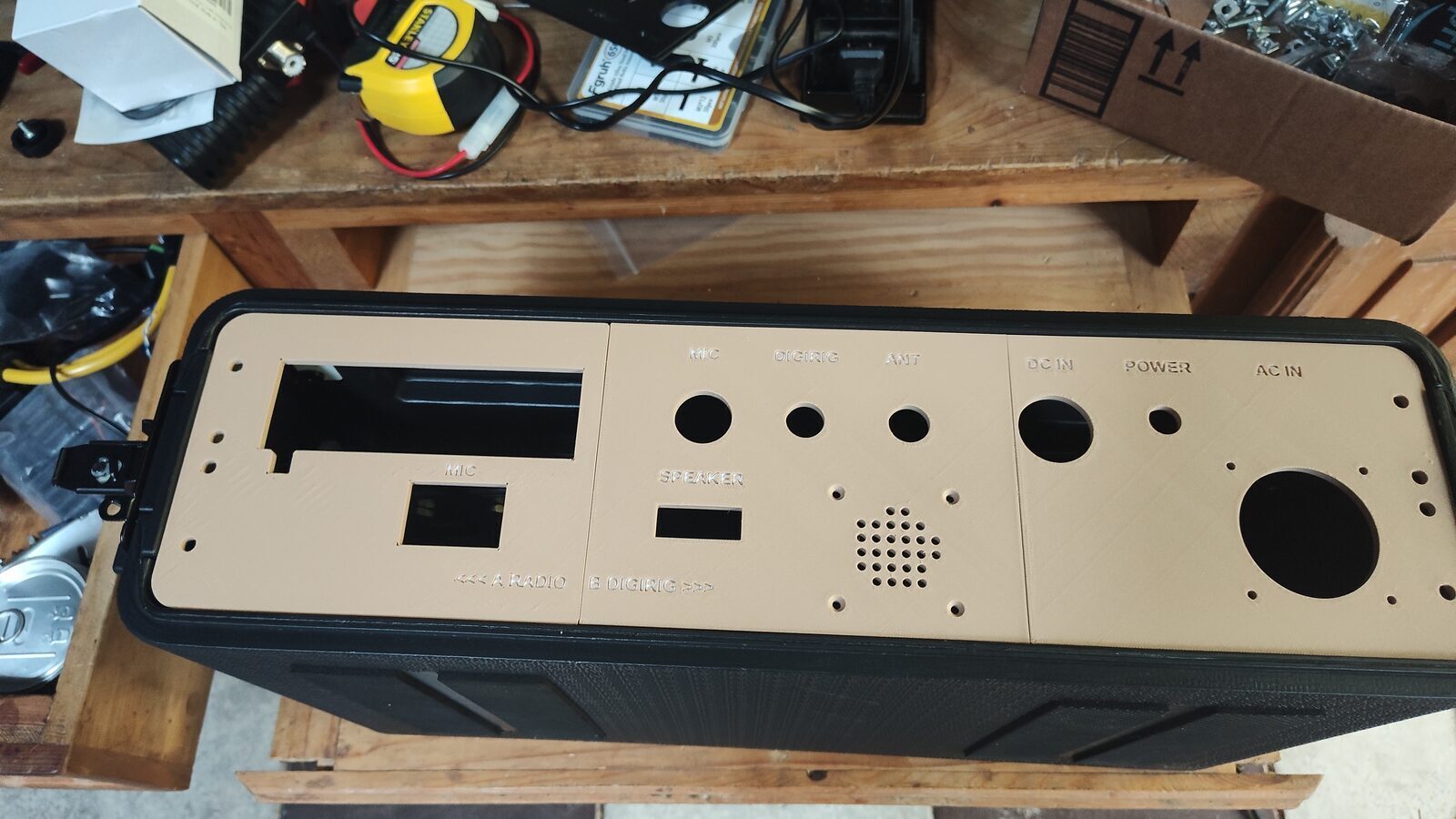 Custom faceplate with the radio controls and connector openings test fitted