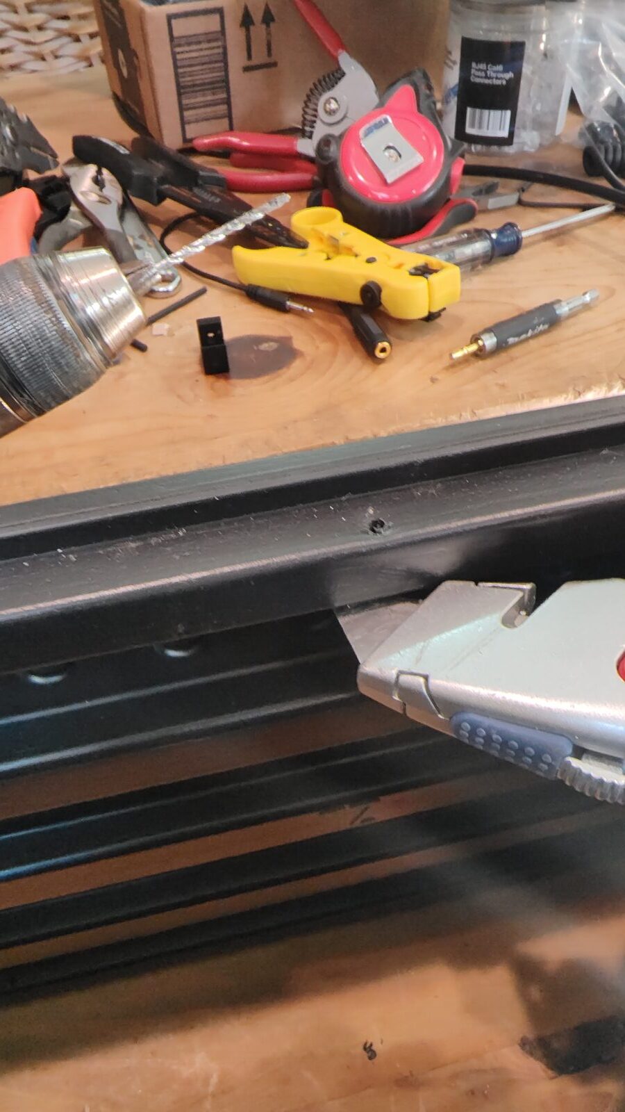 Removing excess plastic from a U-clip after drilling