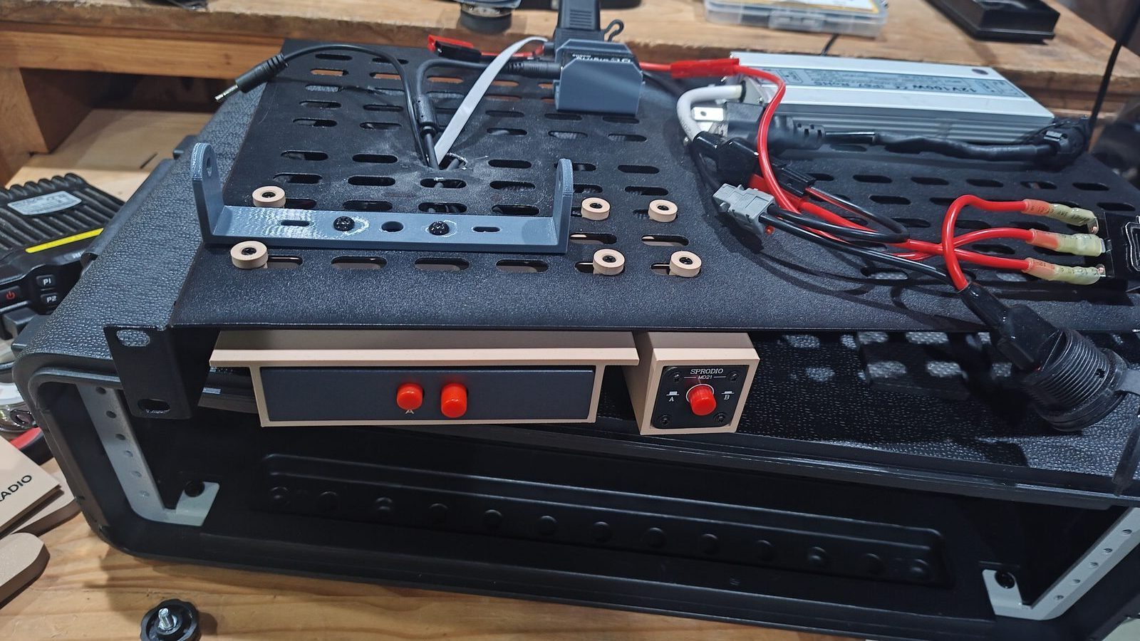 Switch mounts and wiring routed beneath the radio shelf