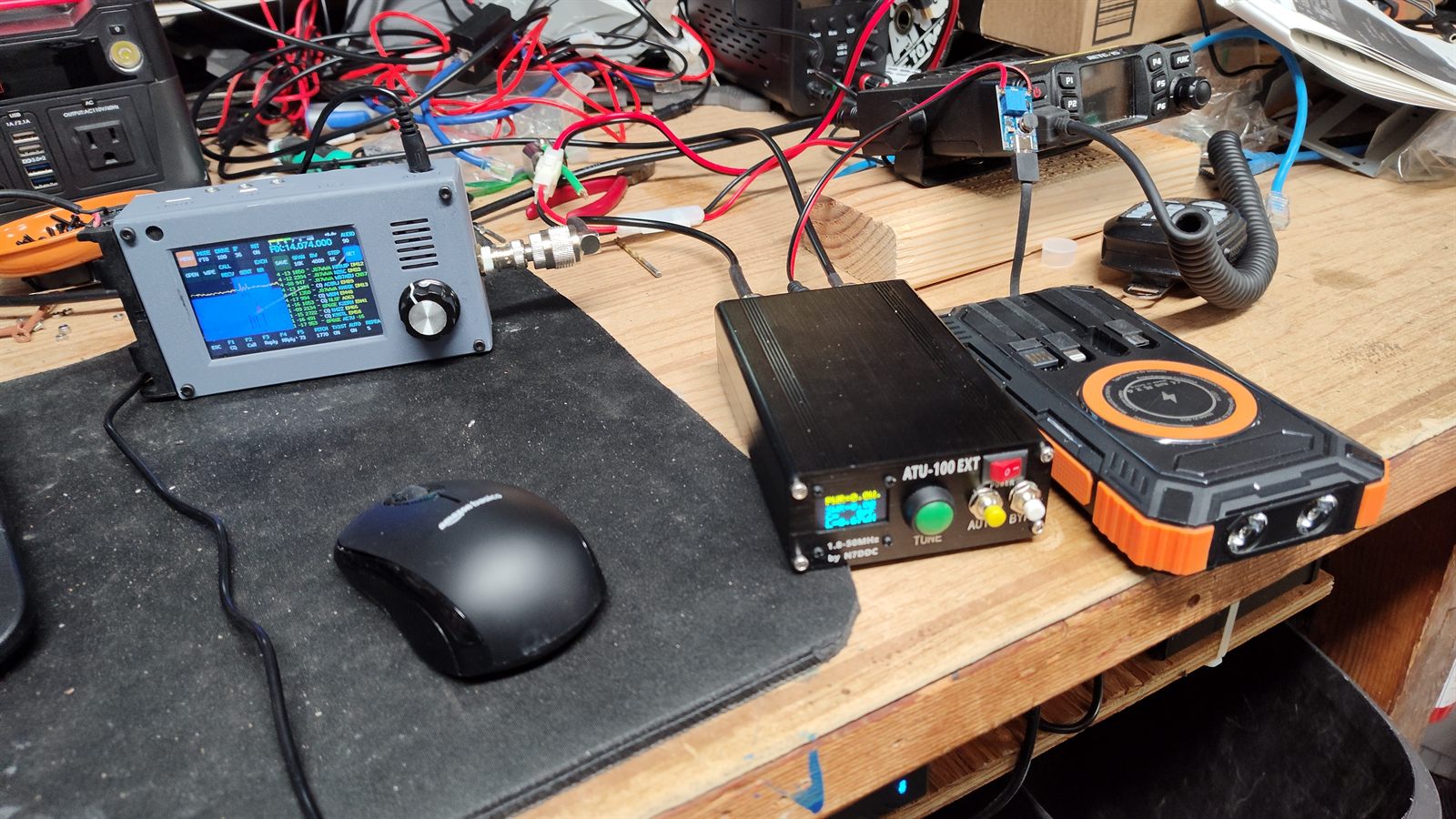 The zBitx, ATU-100 tuner, and bench power supply set up on the shack desk