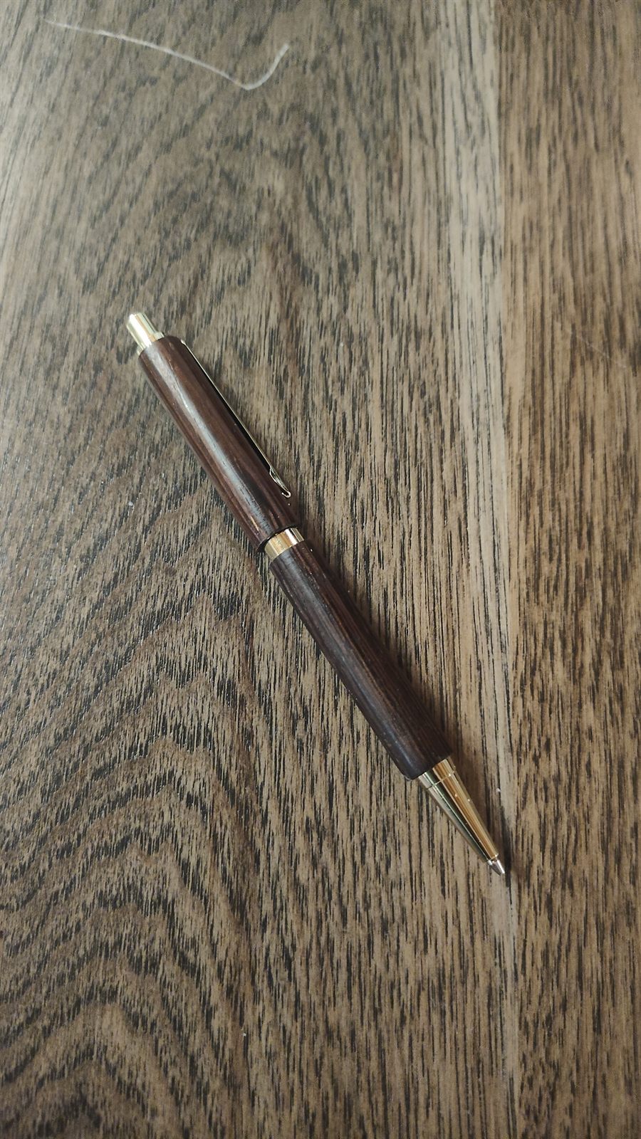 A wood-bodied mechanical pencil with brass fittings, the first piece turned on the new lathe